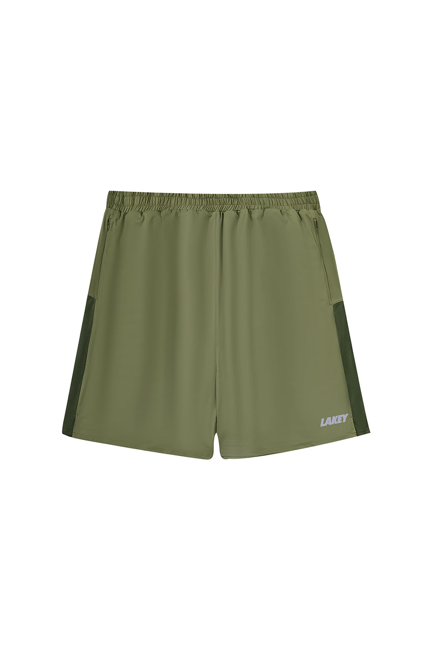 Green athletic shorts with a brand logo on a white background